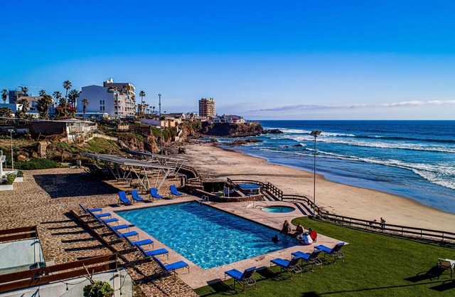 Dog-friendly beachfront villa with pool & hot tub access plus rooftop deck
