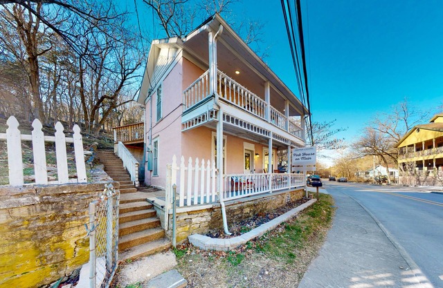 Dog-friendly home with a porch, washer/dryer, balcony, & updated appliances