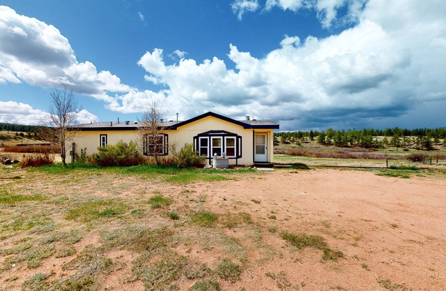 Dog-friendly home with a furnished deck, washer/dryer, & incredible views