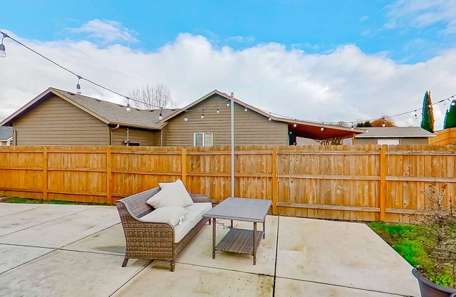 Dog-friendly home with large enclosed yard, patio, BBQ, office, & private W/D