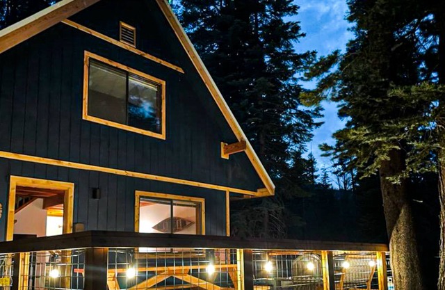 Dog-friendly house in the trees with spacious deck, firepit, hot tub & grill
