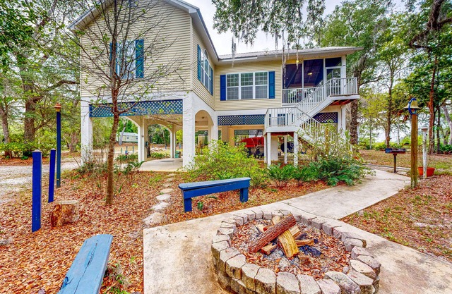 Dog-friendly riverfront home with screened porch, firepit, & private dock