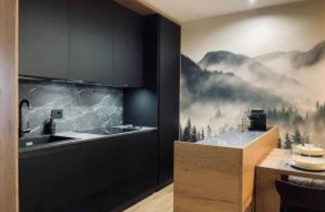 Dolomiti Haus 300 ft from Pampeago ski lifts.