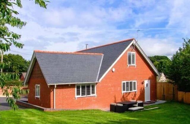 DOUGLAS COTTAGE, with open fire in Penycae
