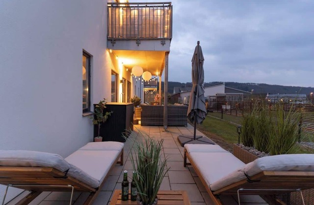 Earthy Ground Floor Home Patio Sunbeds Greenery