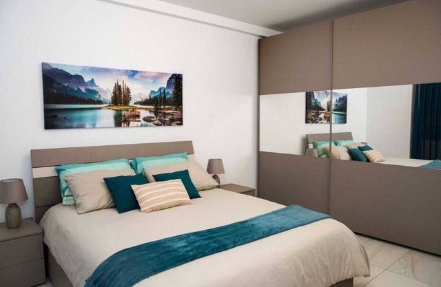 East Garden Residences, modern, central condo with 2 large balconies.