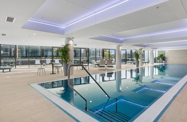 Elegant 2BR Stay with Gym, Cinema & Pool in ACT
