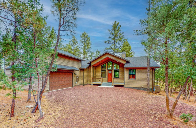Elegant home with expansive patio and fireplace with golf nearby