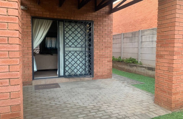 Entire 2 bedroom Duplex with wrap around garden in a secure complex