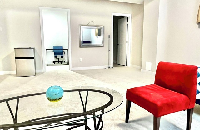Entire basement with large windows, private full bathroom and office