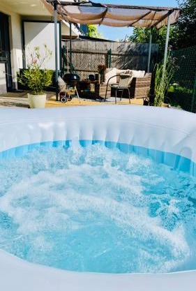 Exclusive Garden Oasis with Jacuzzi & Private Parking
