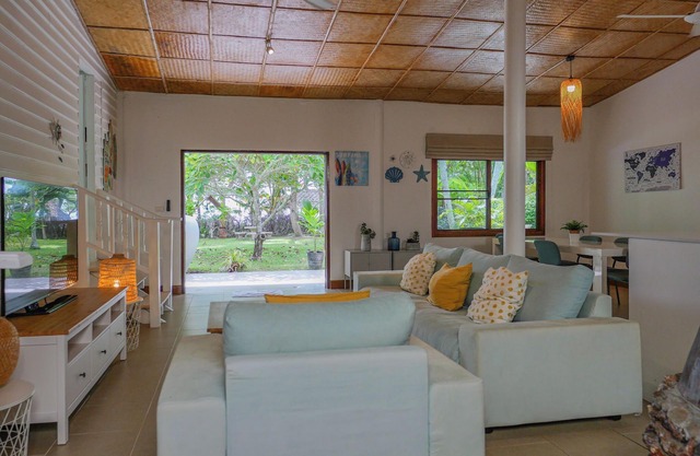 Experience serene sunsets, private beach access, and tropical luxury in this renovated Thai house.