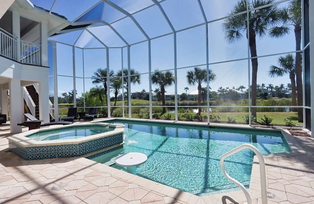 Exquisite river-view home with heated pool and spa in the expansive lanai