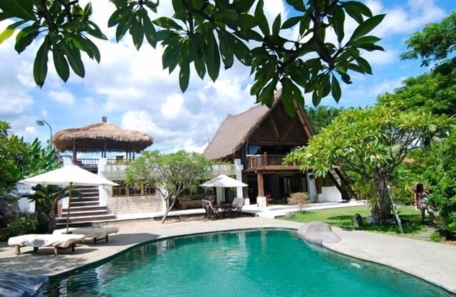 Fabulous villa right on the beach with large pool, tropical garden & staff