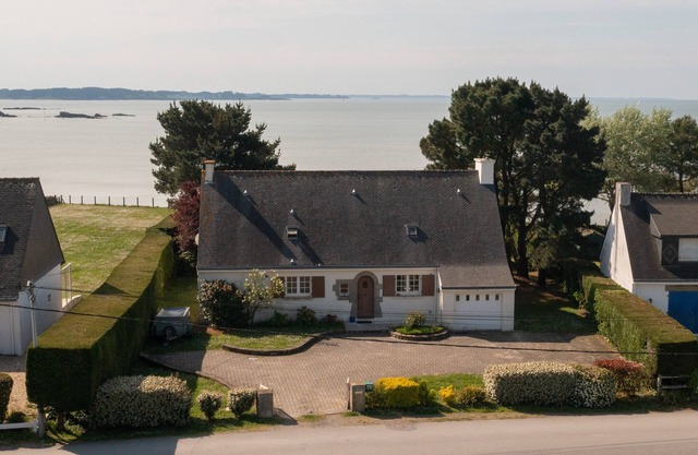 Family home with the ocean at the end of the garden.