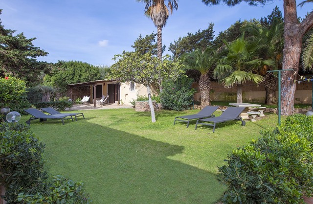 Family villa with large garden on the beach