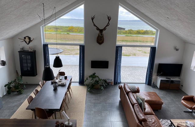 Fantastic home in Ebeltoft with 180 degree sea view and unique living space.
