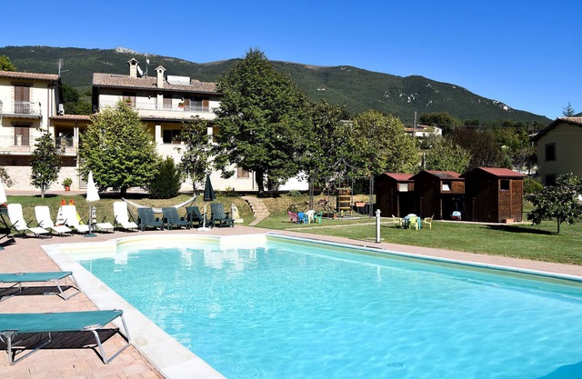 Farmhouse in Assisi countryside with five renovated apartments and a swimming pool
