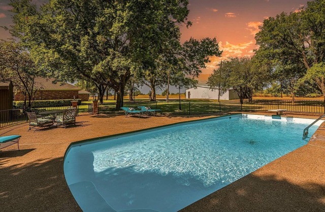 Farmhouse & Ranch style living for your vacay with pond, gazebo, trellis, pool.