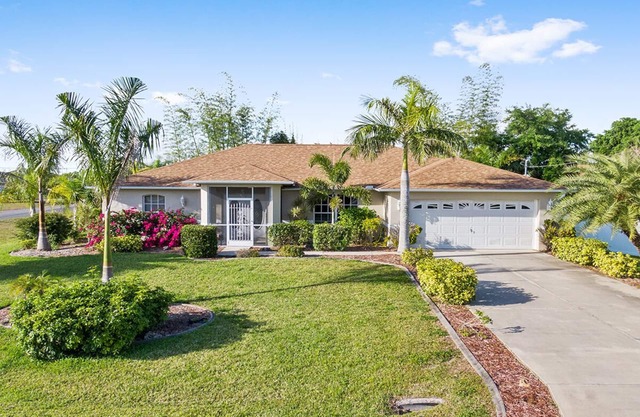 Fenced, private, family friendly villa with exotic poolside views near airport.