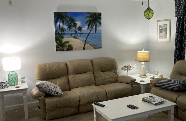 First floor corner unit overlooking 11th fairway on premier golf course.