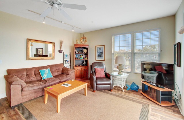 First-floor villa w/partial ocean views, covered porch -one block from the beach