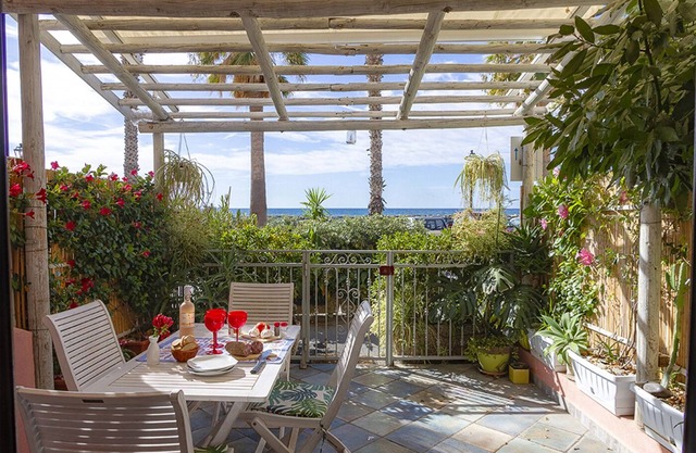 FIRST LINE SEA EDGE GROUND FLOOR-LIVING AND FURNISHED PATIO-CHARMING RESIDENCE