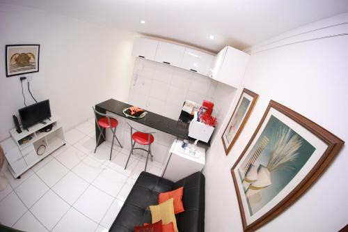 Flat Aconchego BEIRA-MAR térreo quase pé na areia