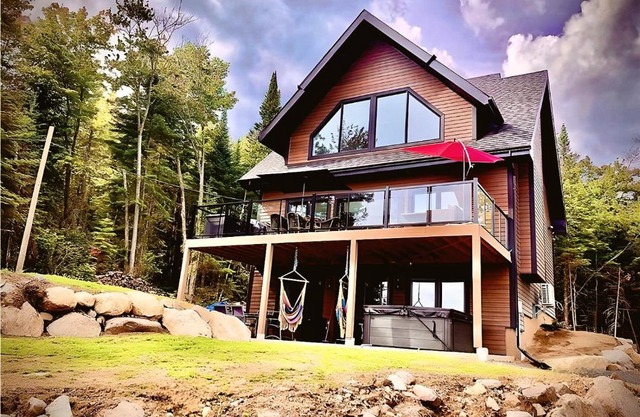 Forest Chalet with Hot Tub & Lake Views near Mont Saint-Sauveur
