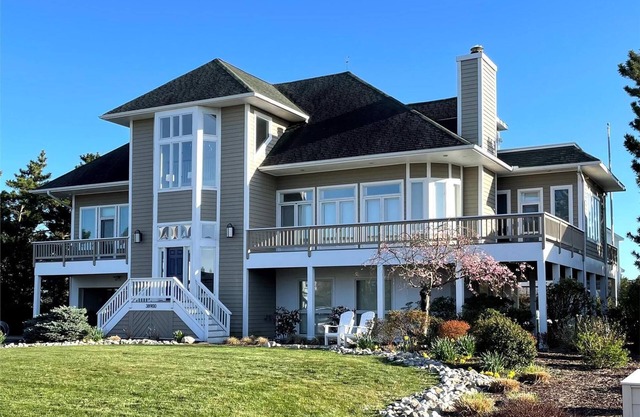 Free Golf at Bear Trap Dunes and MORE! Exceptional, bright and spacious vacation home offers wonderful water views