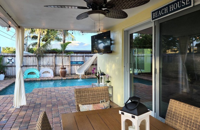 FULLY REMODELED HOME WITH PRIVATE HEATED/CHILLED POOL, WATER SLIDE, POOL TABLE