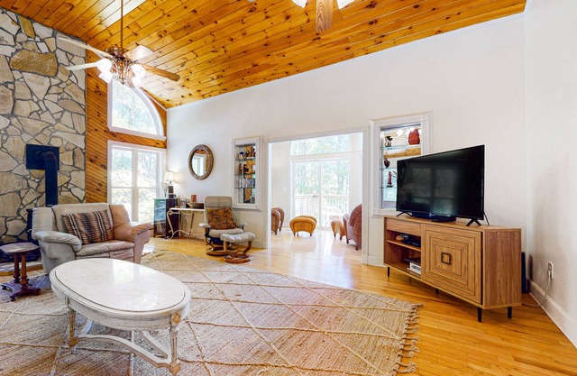 Fun getaway on three wooded acres with furnished deck & forest views