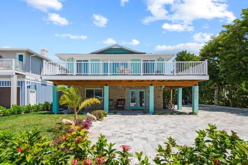 Go to the beach from expansive heated pool home