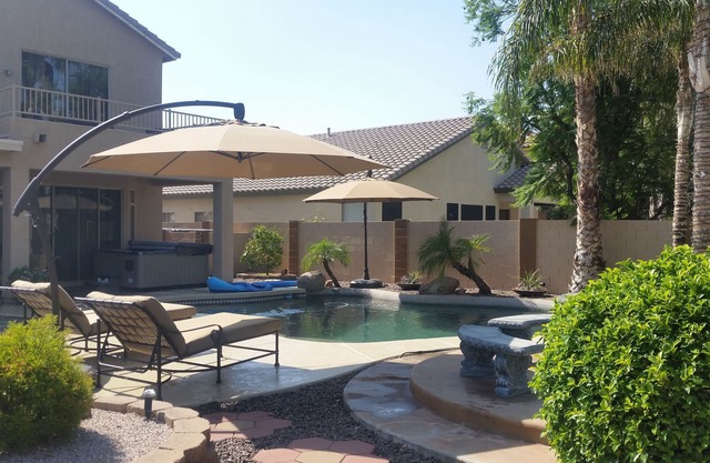 Great House with a jacuzzi, pool, outdoor fireplace & a large backyard!