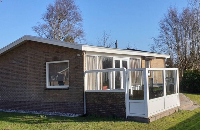 Ground floor House with terrace on south. Near woods and outdoor swimming pool.