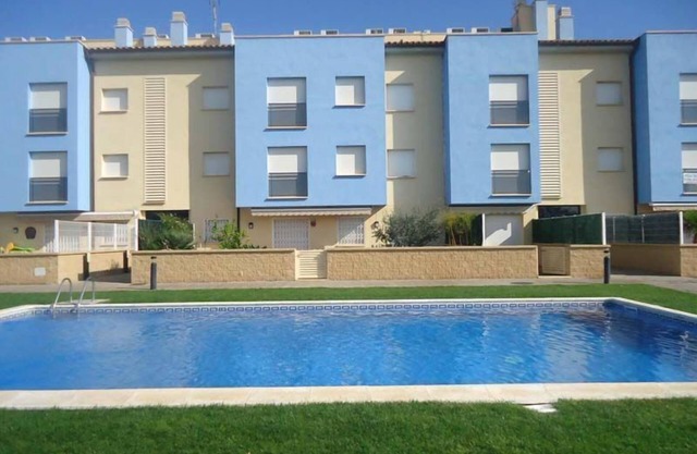 Ground floor with large terrace next to the beach