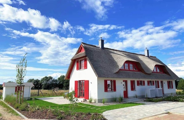Haus zwischen Mühle und Meer