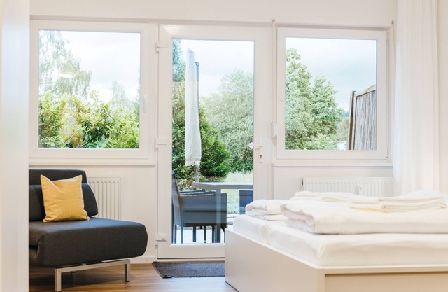 Heimatel family studio including pool and sauna with a large terrace