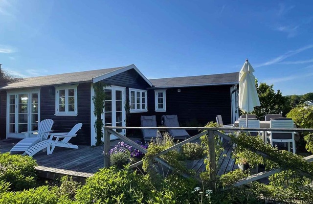 High-lying home with a view of the sea and forest