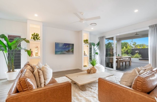 Highlighted by a private outdoor entertaining space with a heated outdoor spa.