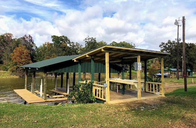 Historic 4 BR Lakefront House with boat house and boat ramp