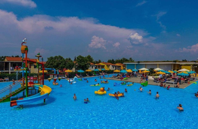 Holiday apartment with pool and sun loungers