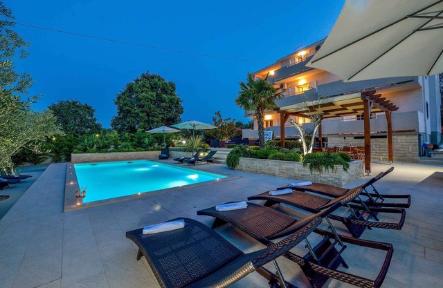 Holiday apartment with sea view and pool