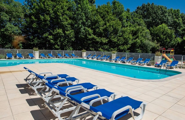 Holiday home in a park with a pool on the lot