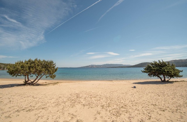 Holiday Home 'Villetta Porto Mannu E9' with Sea View, Private Terrace and Air Conditioning