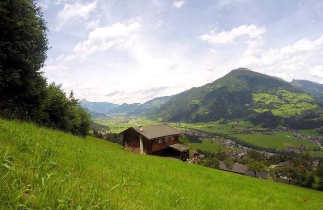 Holiday home with covered waterfront terrace at the forest with beautiful panoramic views directly on the slopes