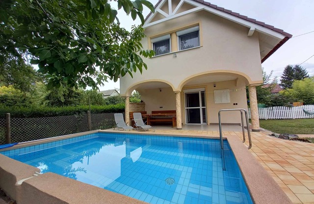 Holiday home with pool and garden shower