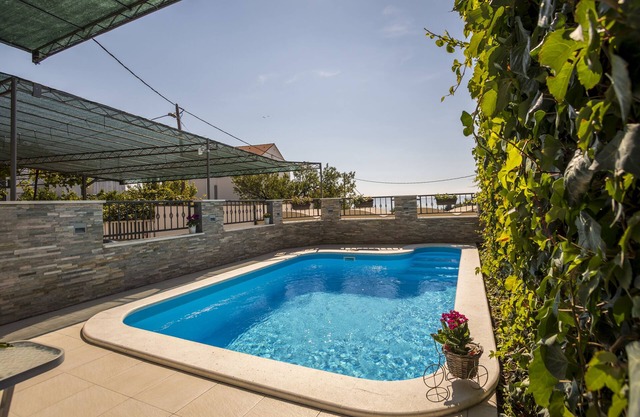 Holiday house with private outdoor swimming pool, family-friendly.
