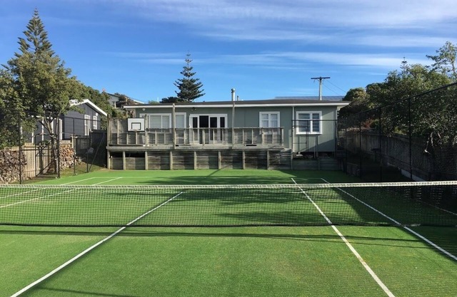 !Holiday special. 7 for 6! Classic 50s seaside bach with tennis court