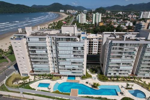 Home 43| Apto em cond Pé na Areia em Bertioga